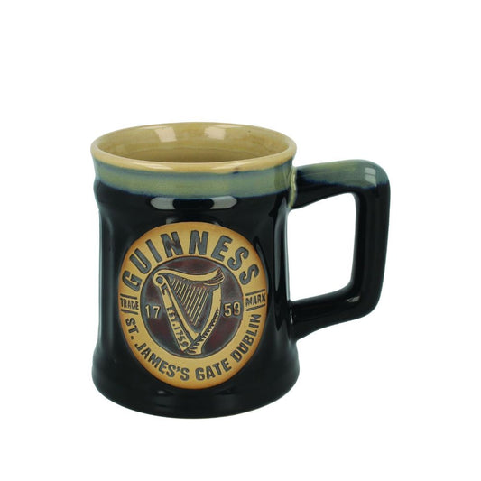 The bold proportions and handmade feel of this mug give it a truly homey look. The large handle makes it easy to carry, while the dark hues give it a masculine feeling and make it the perfect gift for any man in your life. Finished with a large Guinness logo at the front, this mug will quickly become the favourite in your kitchen or office.
