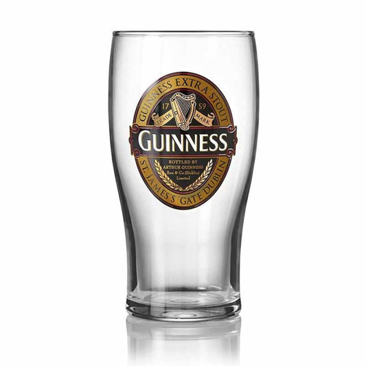 Enjoy your next pint of Guinness with lively ruby red vibes with this Guinness Ruby Red Pint Glass! This pint-sized glass come in a classically elegant, tulip-shaped silhouette, with a base neck that is narrow and gradually flares up to the brim in an elongated bulbous shape. On the front of each glass is a recreation of the Guinness Extra Stout bottle label in a radiant gold and ruby red color scheme.
