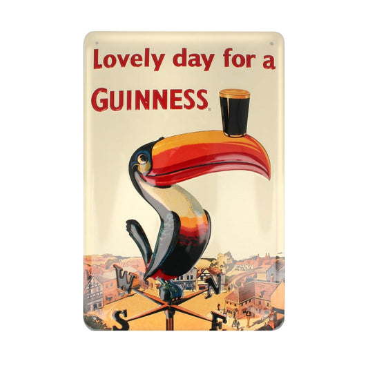 The Guinness 'Lovely day for a Guinness' Wall Art features the 'Lovely day for a Guinness' toucan weathervane vintage ad on the front, is 11"L x 5" and is made from metal. This product is intended for purchase and enjoyment by people of legal purchase age for alcohol beverages.