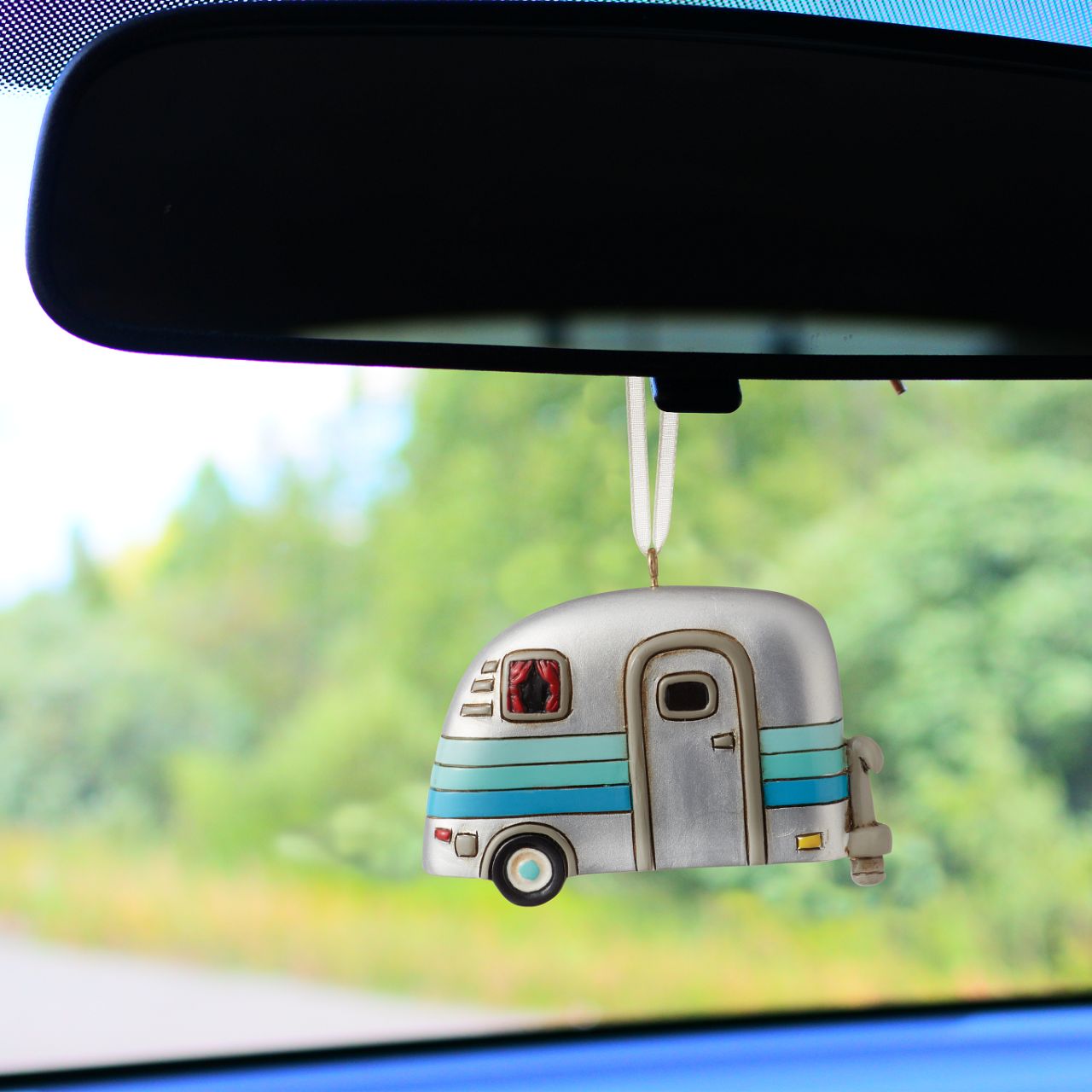 Michelle Allen Happy Camper Hanging Ornament  Who is ready for a camping trip?. Our Happy Camper Hanging Ornament is inspired by a vintage trailer and has so much personality. The shiny silver colour, retro stripes, window and curtain detail adds lots of charisma to this classic design.
