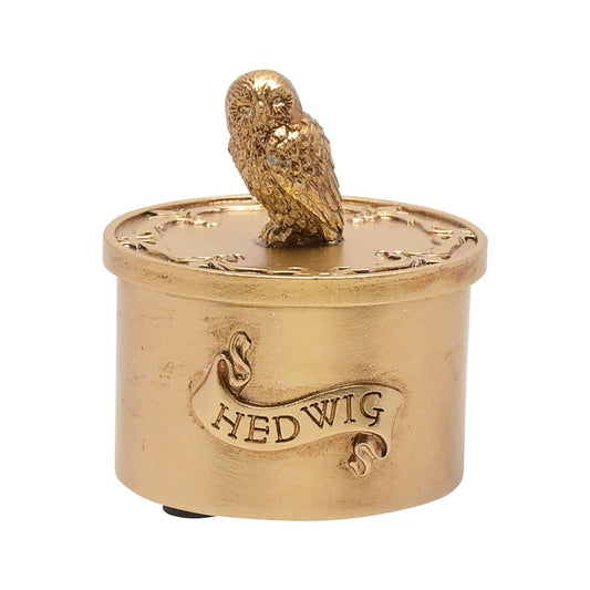Warner Bros Harry Potter Alumni Trinket Box Hedwig  Harry Potter Alumni Trinket Box Hedwig  A Hedwig trinket box by HARRY POTTER®.  This spellbinding trinket box is adorned Hedwig the Owl and filled with Hogwarts magic.