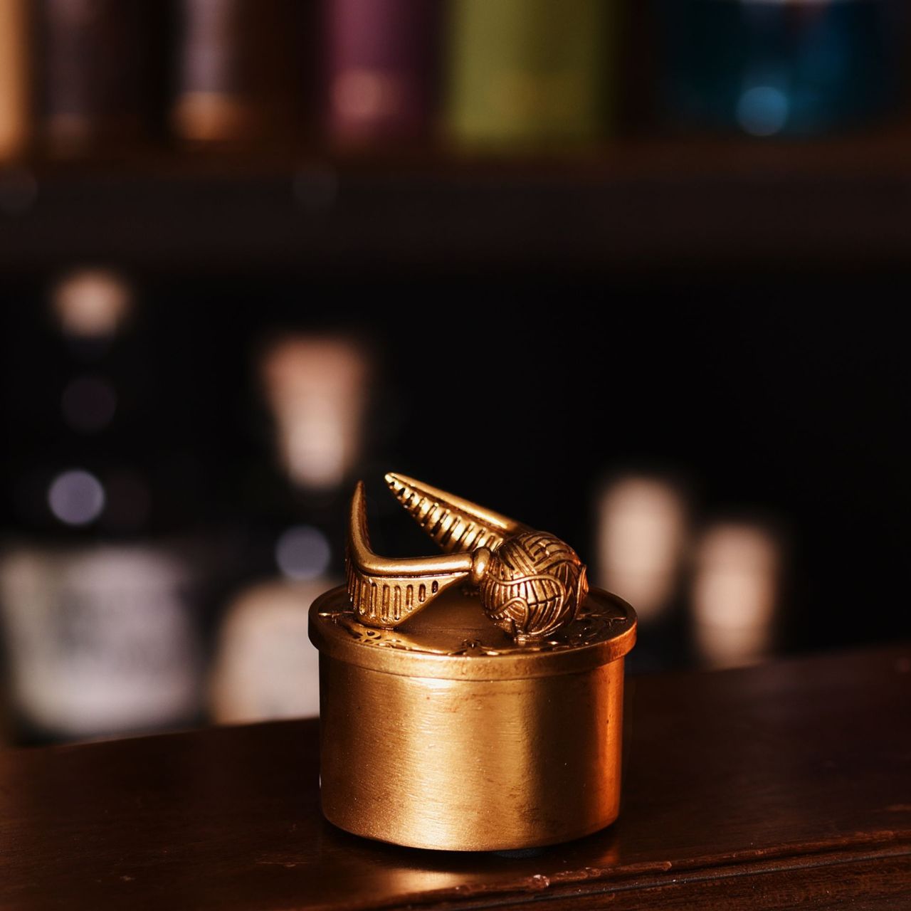 Warner Bros Harry Potter Alumni Trinket Box Snitch  A Snitch trinket box by HARRY POTTER®.  This spellbinding trinket box is adorned a Golden Snitch and filled with Hogwarts magic.