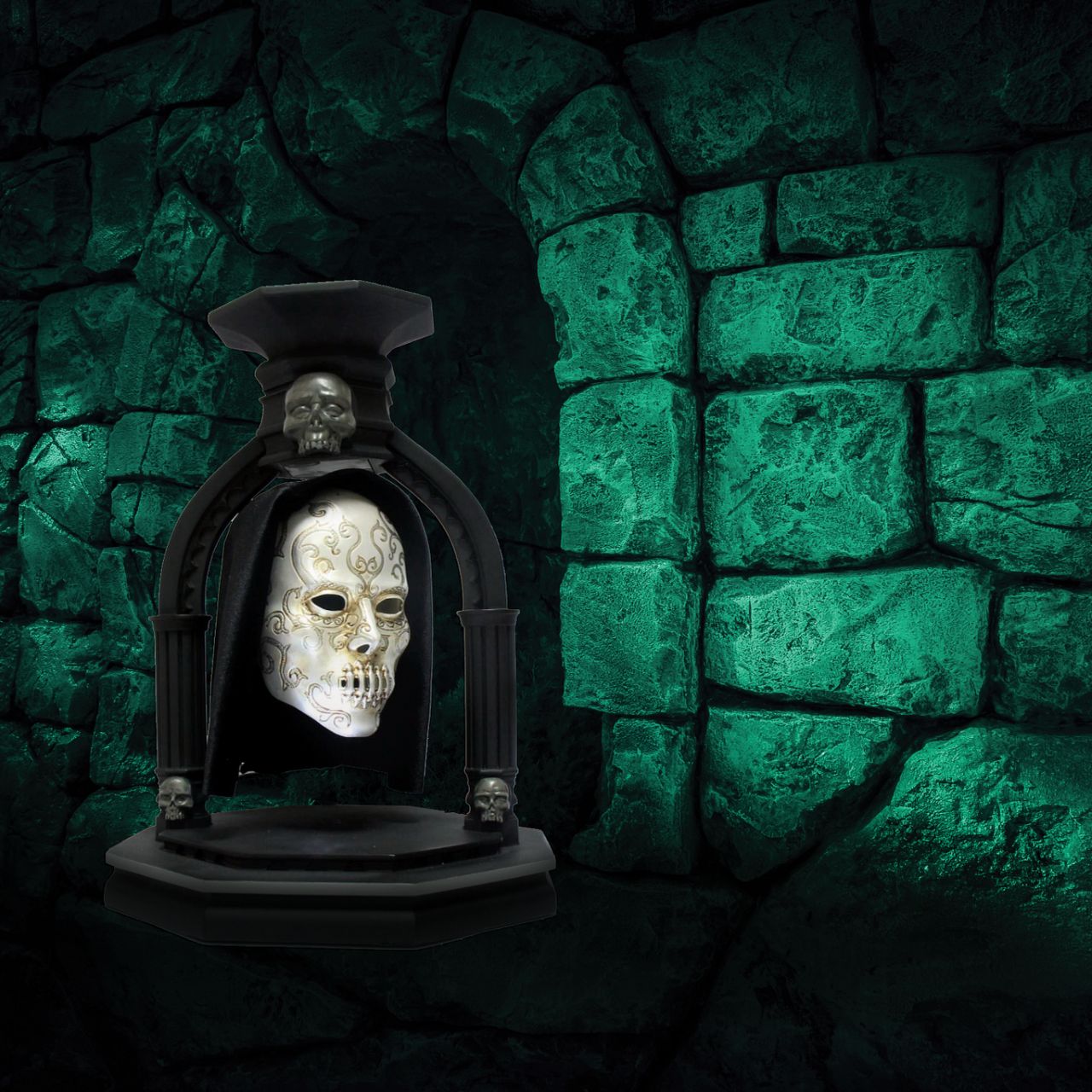 NEW and exclusively from Enesco is the Bellatrix Lestrange Levitating Death Eater Mask. This piece works using polarized magnets to hold the mask in place, floating in mid air with an LED light indicating when the magnet is activated.