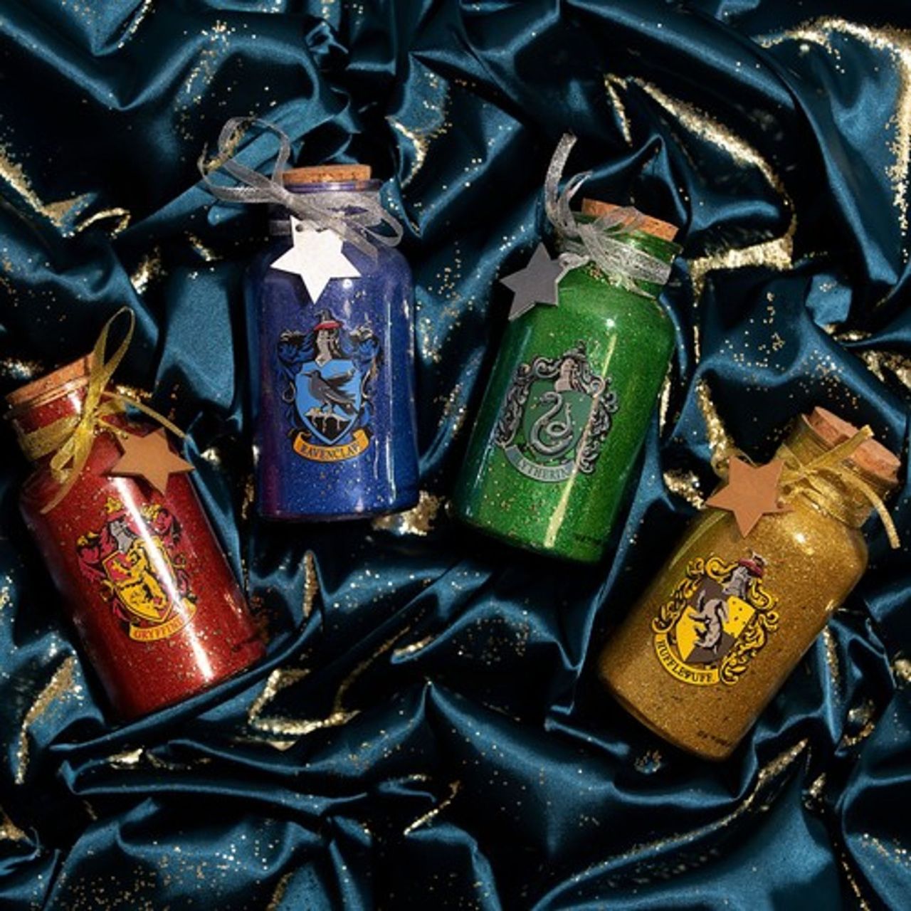 Harry Potter LED Light Up Glass Jar House - Ravenclaw  Lumos maxima! Light up your home this Christmas with these LED glass jar lights. With a glitter design and featuring all four houses, these accessories are sure to add a sprinkle of magic.