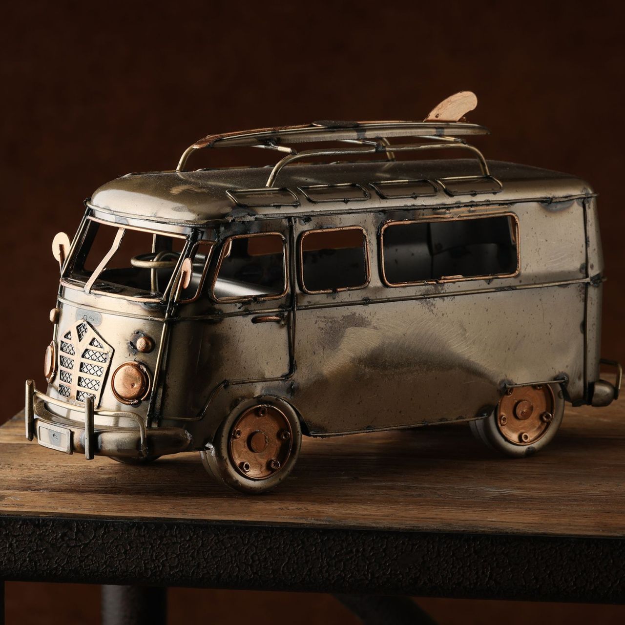 Introduce a touch of vintage charm to any space with the Harvey Makin Campervan Ornament. This delightful model, styled as a classic van, exudes a nostalgic, laid-back vibe, perfect for those who love a retro aesthetic or dream of coastal adventures.