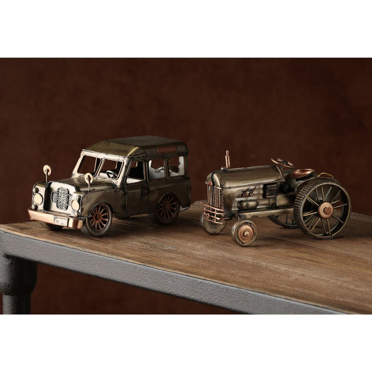 Introducing the Harvey Makin Ornament - Tractor, an embodiment of vintage charm with its intricate details and prominent engine. This model, with its large wheels, is a nostalgic nod to the heart of rural life, making it a perfect gift for those who appreciate classic machinery.