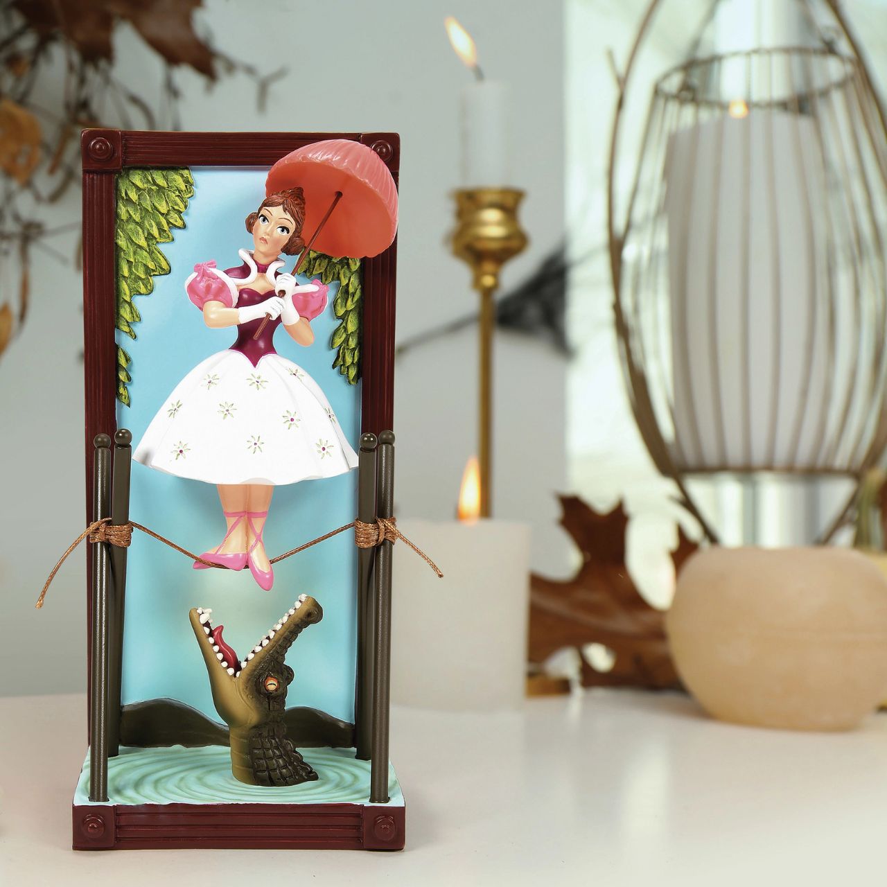 Step into our art gallery with no windows and no doors and marvel at a framed stretching portrait named Tightrope Girl from Disney's Haunted Mansion. The 3 dimensional figurine shows a contrast of calmness and danger which captures the Haunted Mansion's unique blend of whimsy and fear.