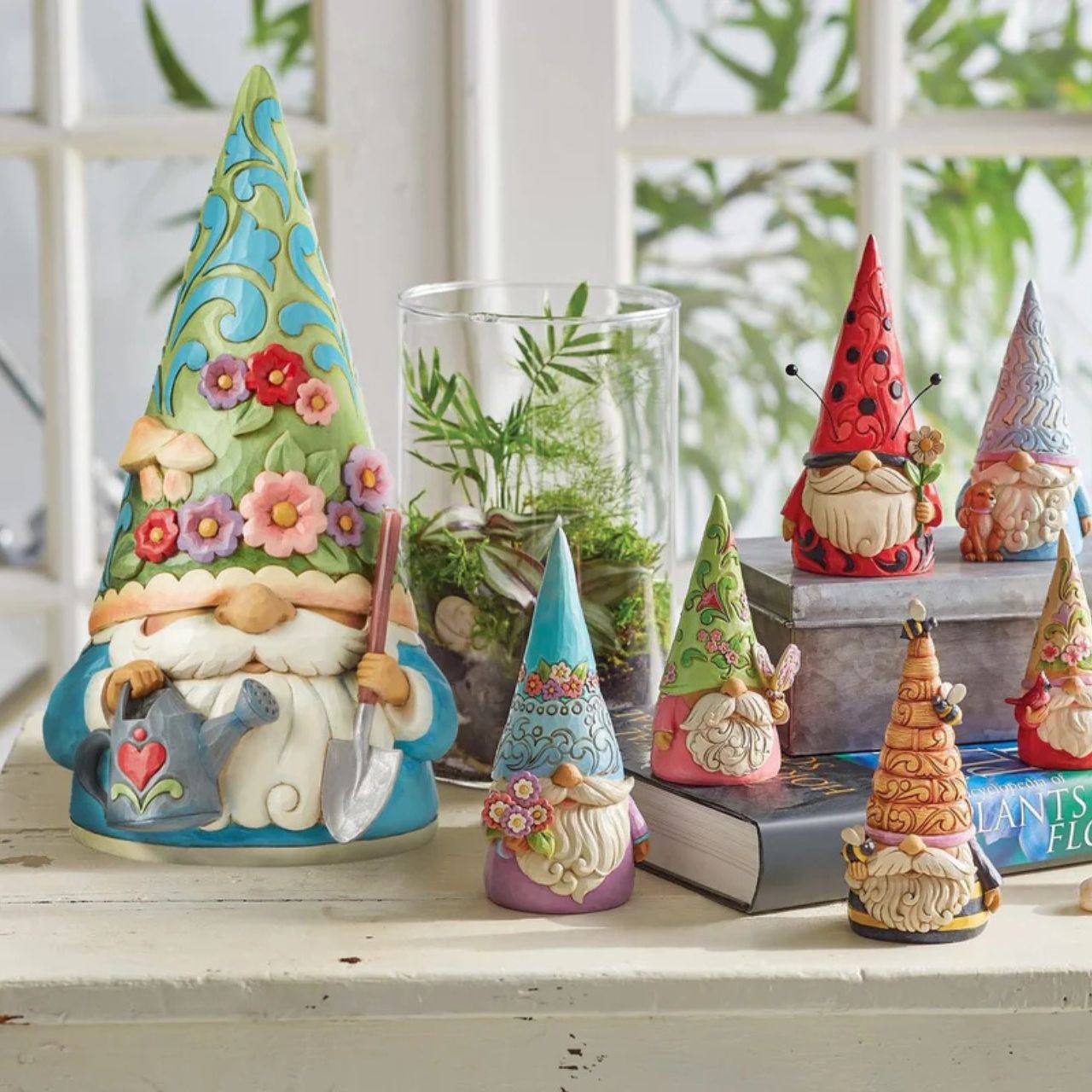 "Bloom and Grow" For centuries, gnomes have been symbols of good luck, they are thought to provide protection with their delightful charm. This Jim Shore gnome is ready to garden, and wears a flower and fungi patterned hat while holding a watering can and shovel.