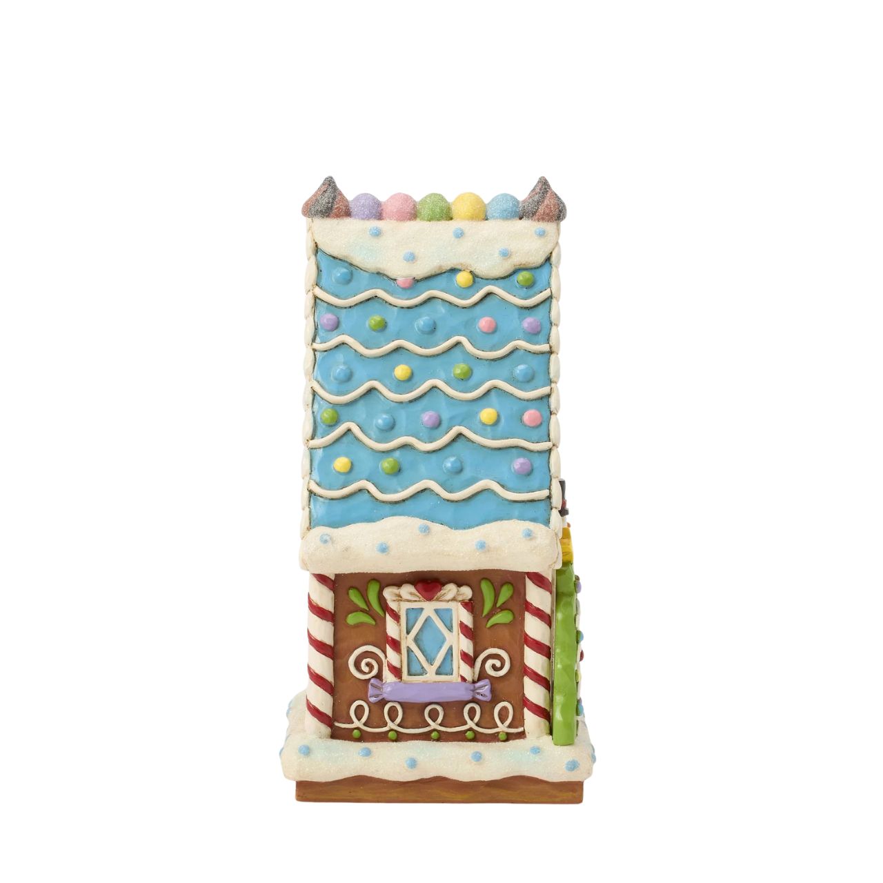 This enchanting Jim Shore LED light-up sweet shop invites you into a festive gingerbread house with colourful icing, cookies, and candy. Glowing warmly, it promises a world of delicious treats and holiday cheer, making it a delightful centerpiece.