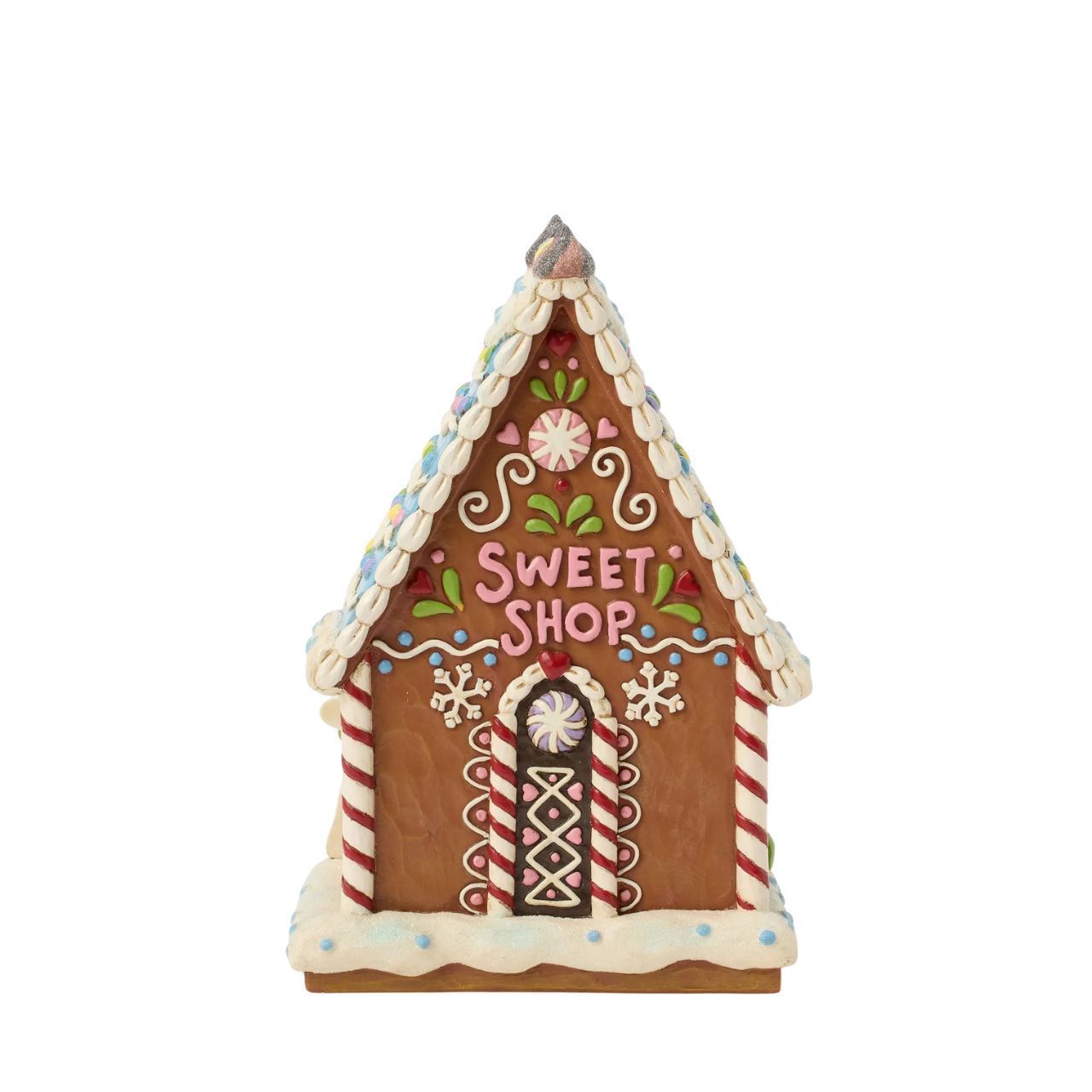 This enchanting Jim Shore LED light-up sweet shop invites you into a festive gingerbread house with colourful icing, cookies, and candy. Glowing warmly, it promises a world of delicious treats and holiday cheer, making it a delightful centerpiece.