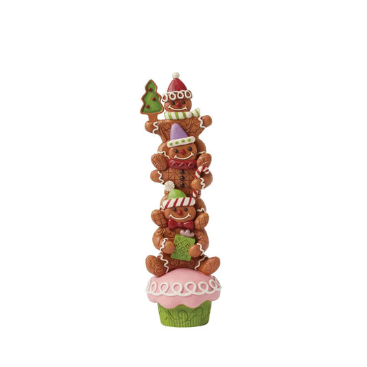 This delightful Gingerbread Christmas Jim Shore design features a festive cupcake topped with three cheerful gingerbread men, each adorned with colorful icing, candy, sprinkles, with signature Jim Shore patterning. They sure capture the joy and warmth of Christmas season.