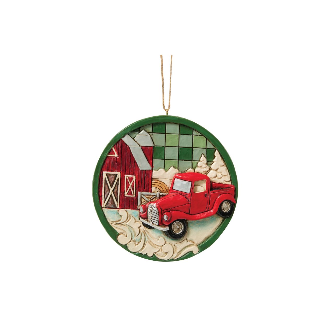 This charming Jim Shore Highland Glen ornament showcases a cozy farm scene with a classic red pickup truck surrounded by lush pines, all set against a green plaid background. This festive piece shares a calming sense of rural holiday charm.
