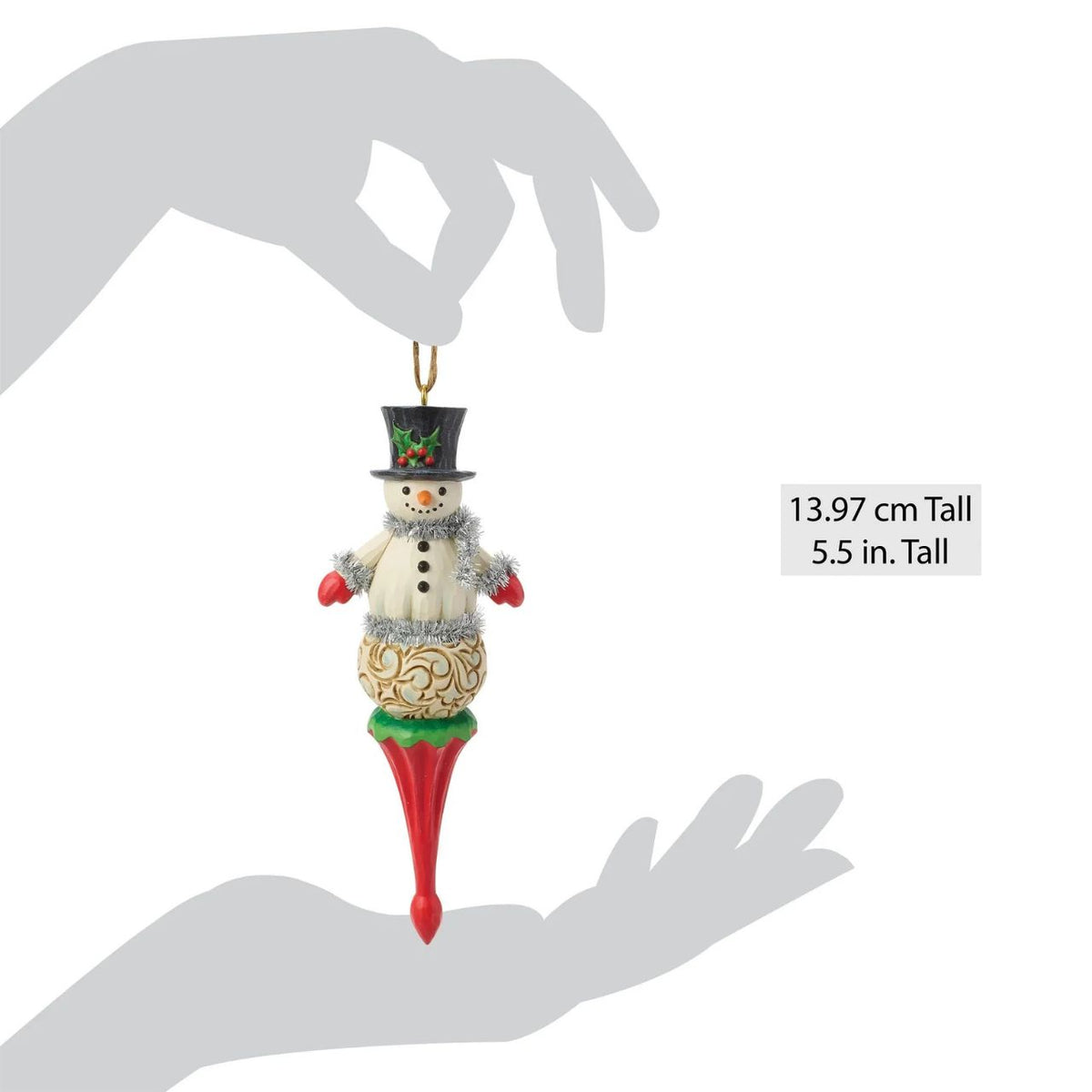 Capture the magic of Christmas with this delightful Snowman Figurine from Heartwood Creek by Jim Shore. This exquisitely crafted piece combines Jim Shore's unmistakable folk-art style with the timeless appeal of a festive snowman.