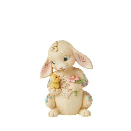This mini Bunny figurine from the Heartwood Creek collection by Jim Shore is the perfect little addition to any Easter display. Hand carved and painted, this piece comes in fully branded packaging.