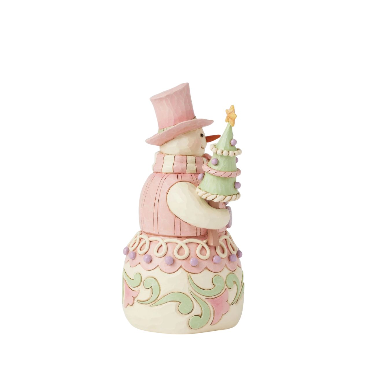This whimsical Heartwood Sweets pastel pink snowman by Jim Shore radiates charm with his rosemaling patterns, sprinkles, and icing details, embodying the essence of holiday cheer. He lovingly holds a decorated tree and a cardinal.