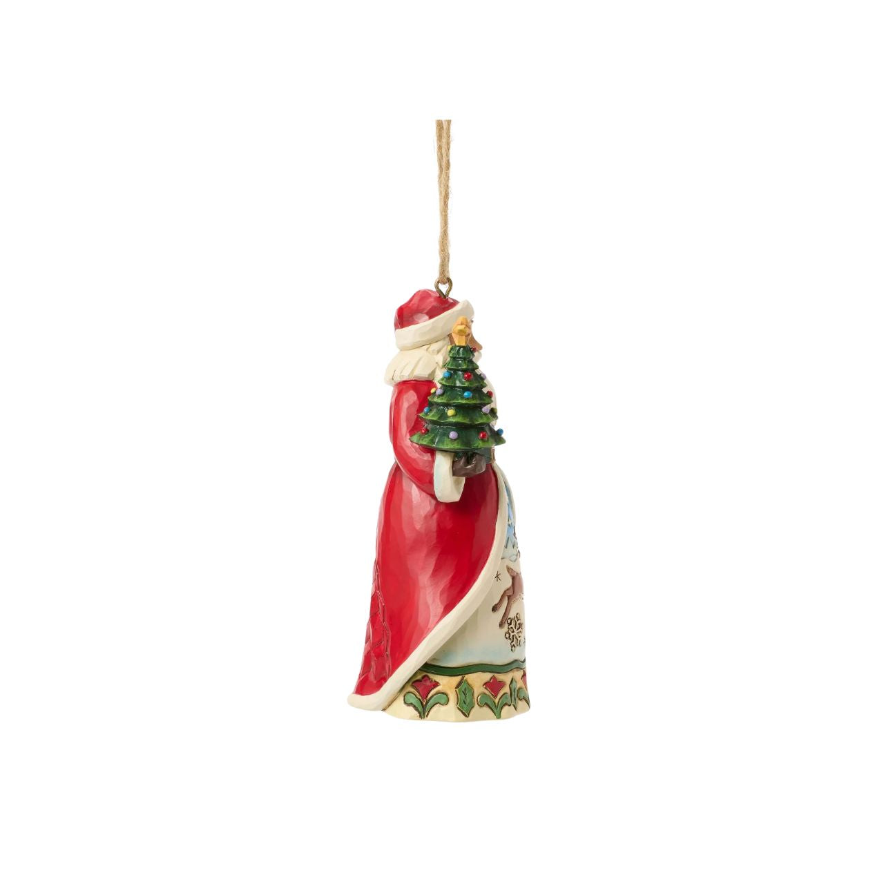 This enchanting Jim Shore Christmas tree ornament features Santa holding a miniature tree and gifts, ready to spread holiday cheer. His cloak opens to reveal a serene winter scene with a playful reindeer frolicking through the snow.