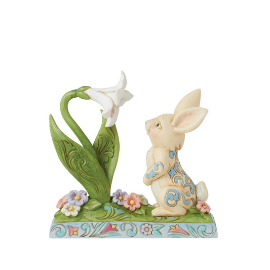Celebrate Spring breaking through and the joy of Easter with this sweet figurine of a bunny sniffing the first Lilly of the season. Hand carved and painted. Comes in fully branded packaging.