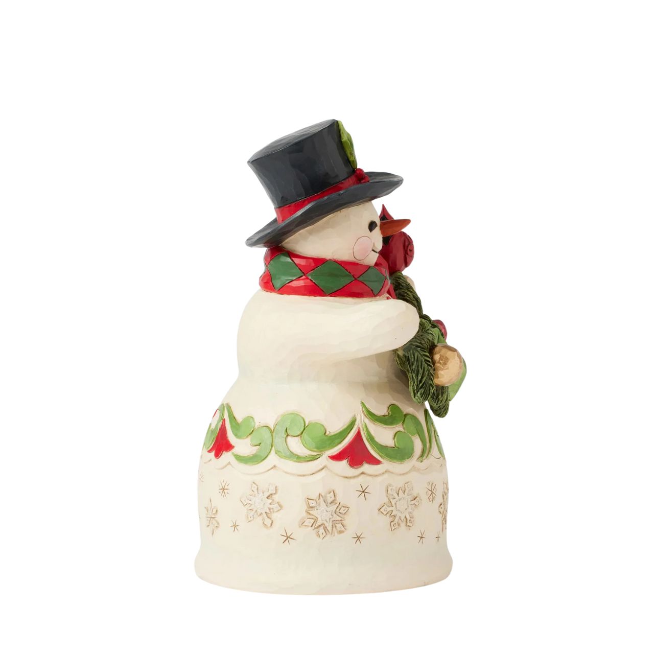 This charming snowman wears intricate snowflakes and Jim Shore's iconic rosemaling designs, spreading festive cheer while holding garland and a cardinal. Wearing a holly-trimmed top hat and a smile, he makes the season brighter.