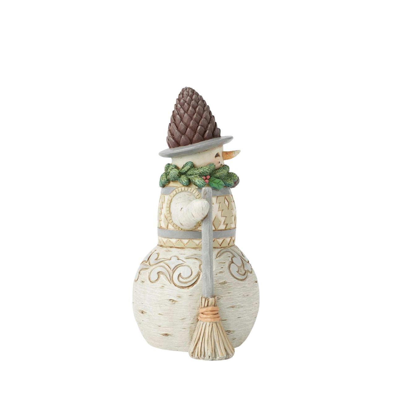 This cheerful Jim Shore designed snowman carrying a broomstick, sure is exuding charm with a wreath wrapped around his neck as a scarf and a pinecone hat. His delightful details capture the beauty of winter and the joy of the season.