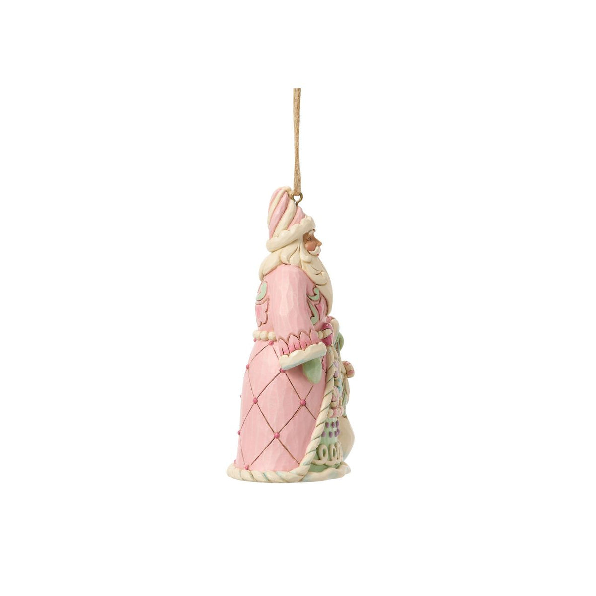 This cheerful Santa ornament carries a sack overflowing with colourful candy delights. Jim Shore's hand-painted details and rosemaling patterns give Santa a rich, festive charm. A sugary-sweet nod to childhood holiday dreams.