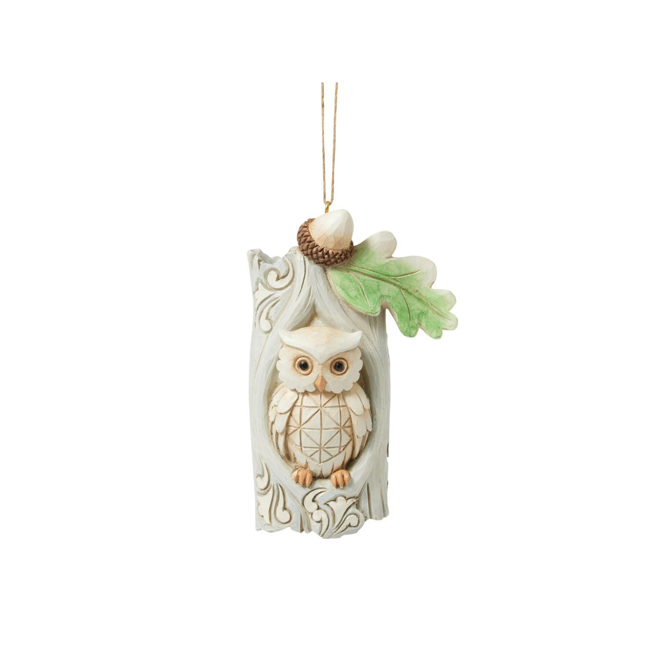 This delightful Jim Shore ornament features a charming owl nestled comfortably in the hole of an acorn tree, capturing the serenity of woodland life. With intricate detailing, this piece adds a touch of nature-inspired charm to your holiday tree.
