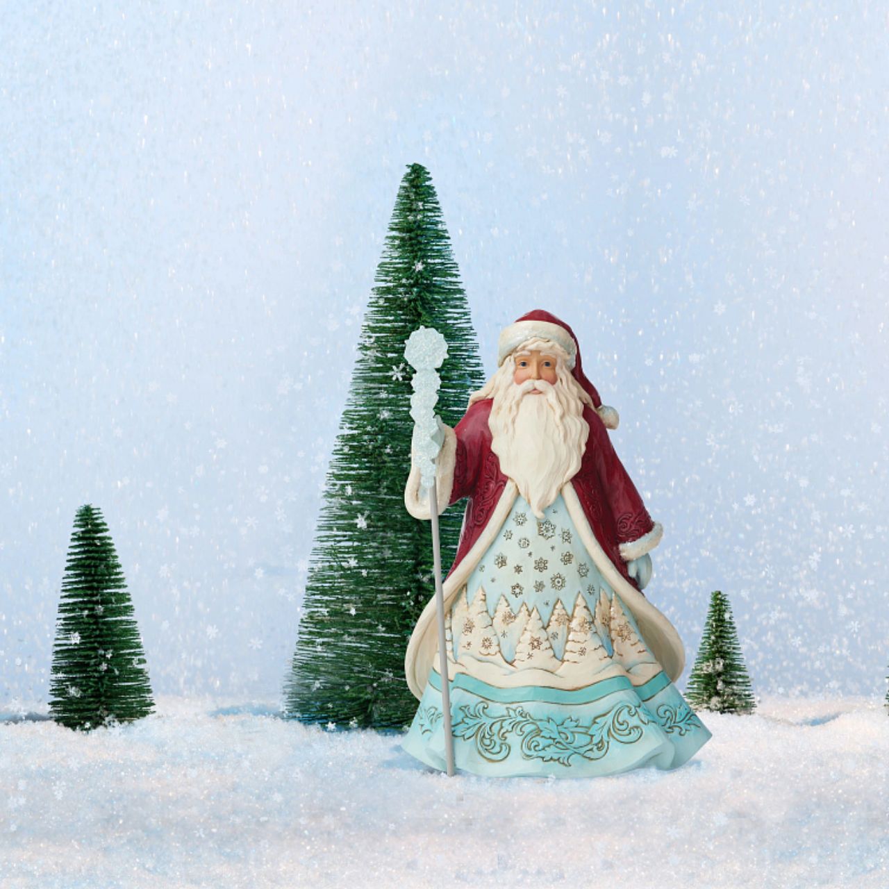"Ice and Snow Can Warm The Soul" This icey Santa has been designed by Jim Shore as part of his Winter Wonderland collection. His staff is topped by an acrylic snowflake to add to the feeling of snow and ice before added embellishments of glitter are added.