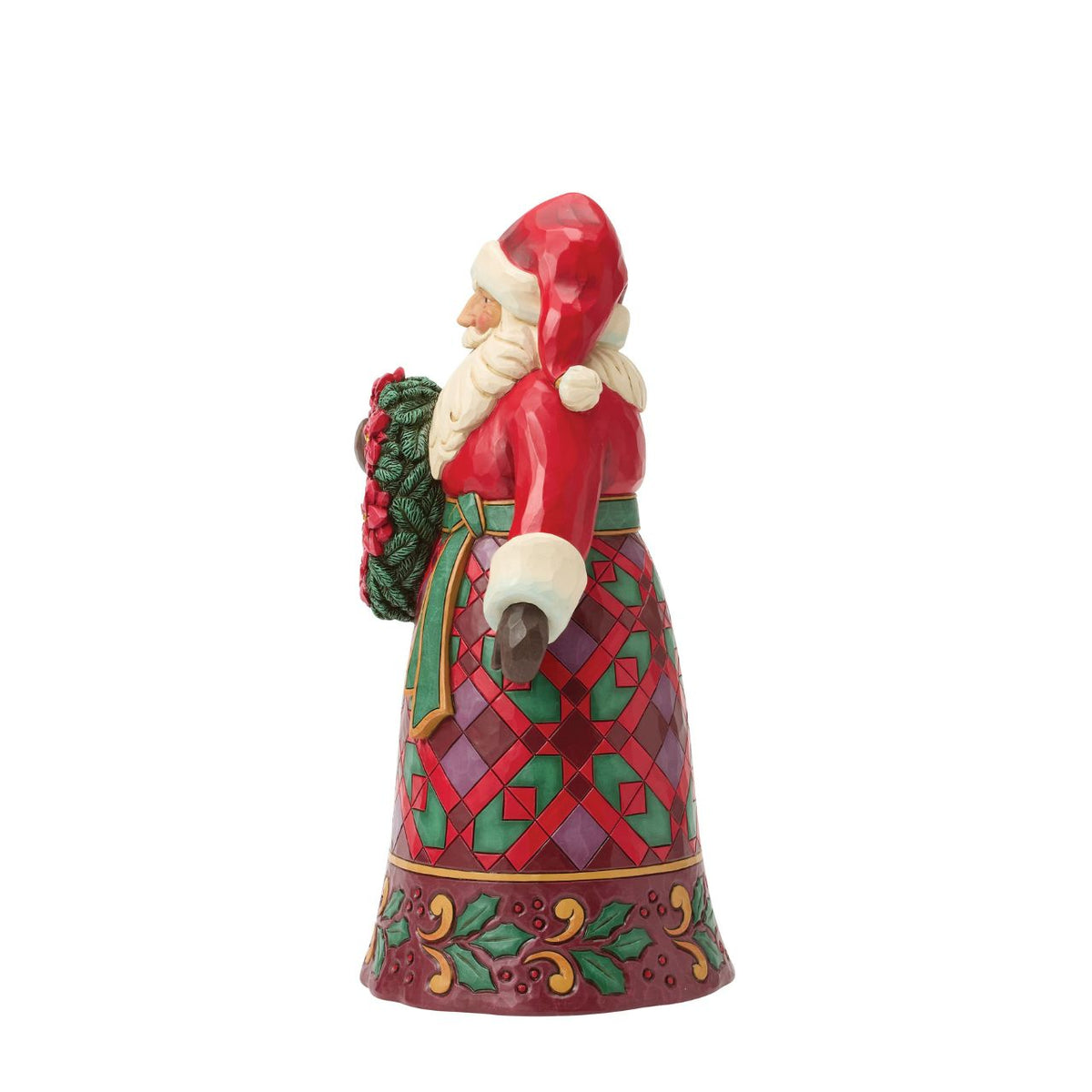Santa holds a wreath ornamented with vivid poinsettias, a symbol of Christmas joy. Jim Shore's intricate rosemaling and warm colours make this Santa timeless holiday accent. A beautiful way to bring floral festivity to your home.