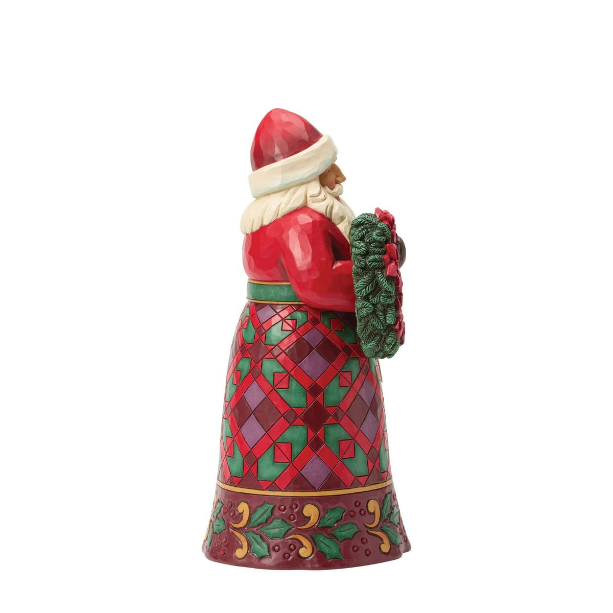 Santa holds a wreath ornamented with vivid poinsettias, a symbol of Christmas joy. Jim Shore's intricate rosemaling and warm colours make this Santa timeless holiday accent. A beautiful way to bring floral festivity to your home.