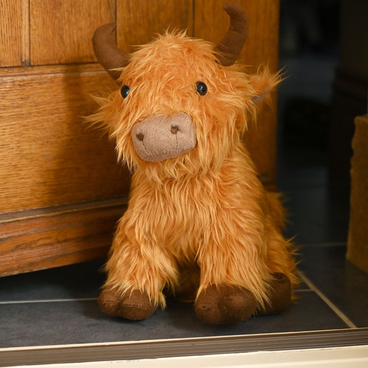 Featuring a plush, furry exterior and prominent horns, this Highland Cow Doorstop captures the iconic look of these shaggy bovines. Keep doors propped open in style.