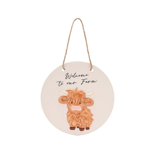 Featuring an adorable highland cow illustration and the friendly message "Welcome to our Farm," this ceramic sign is perfect for greeting visitors with a smile.