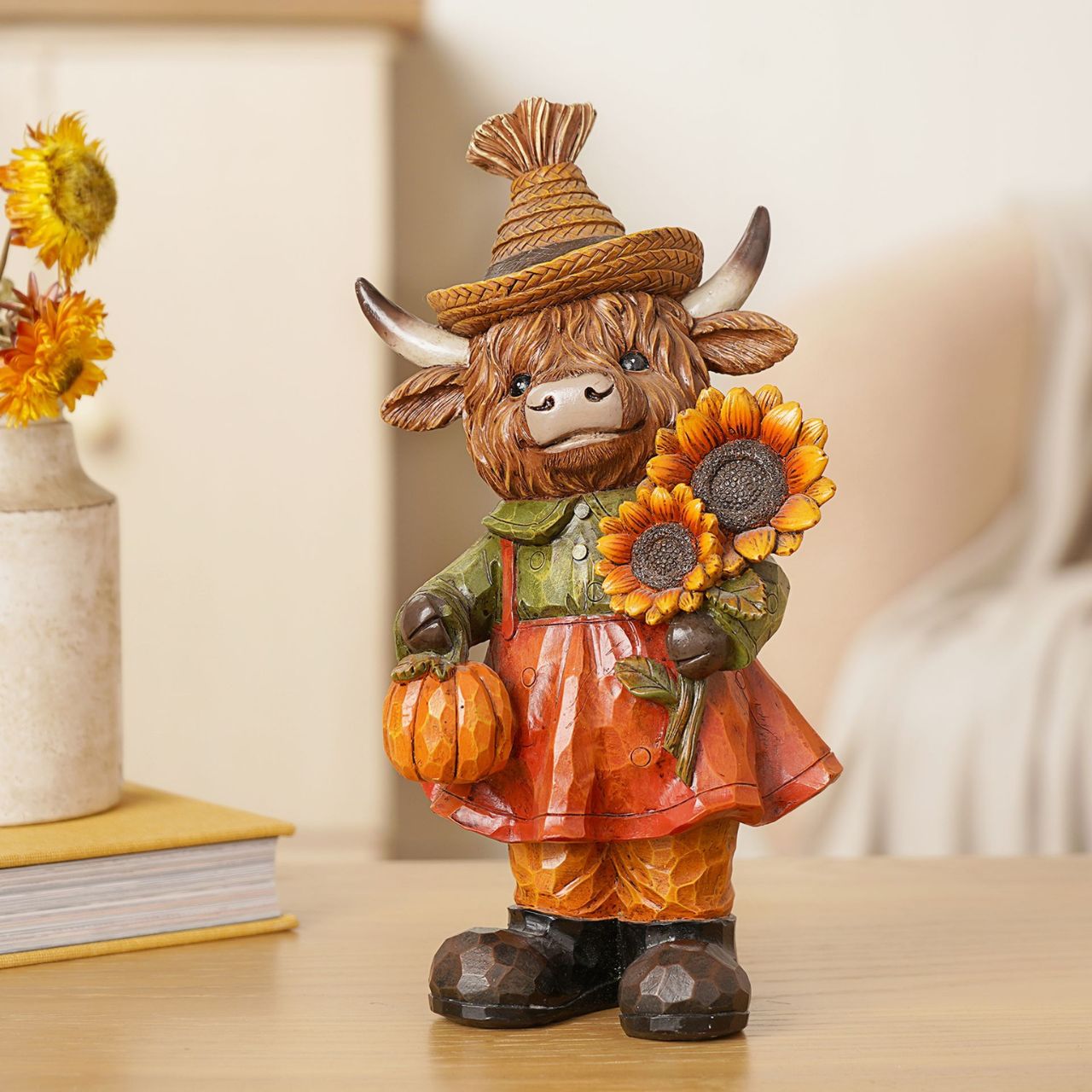 The Country Living Autumn Highland Cow Figurine Collection brings rustic character to home décor displays.