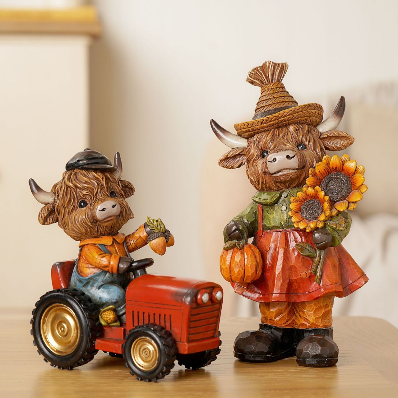 The Country Living Autumn Highland Cow Figurine Collection brings rustic character to home décor displays.