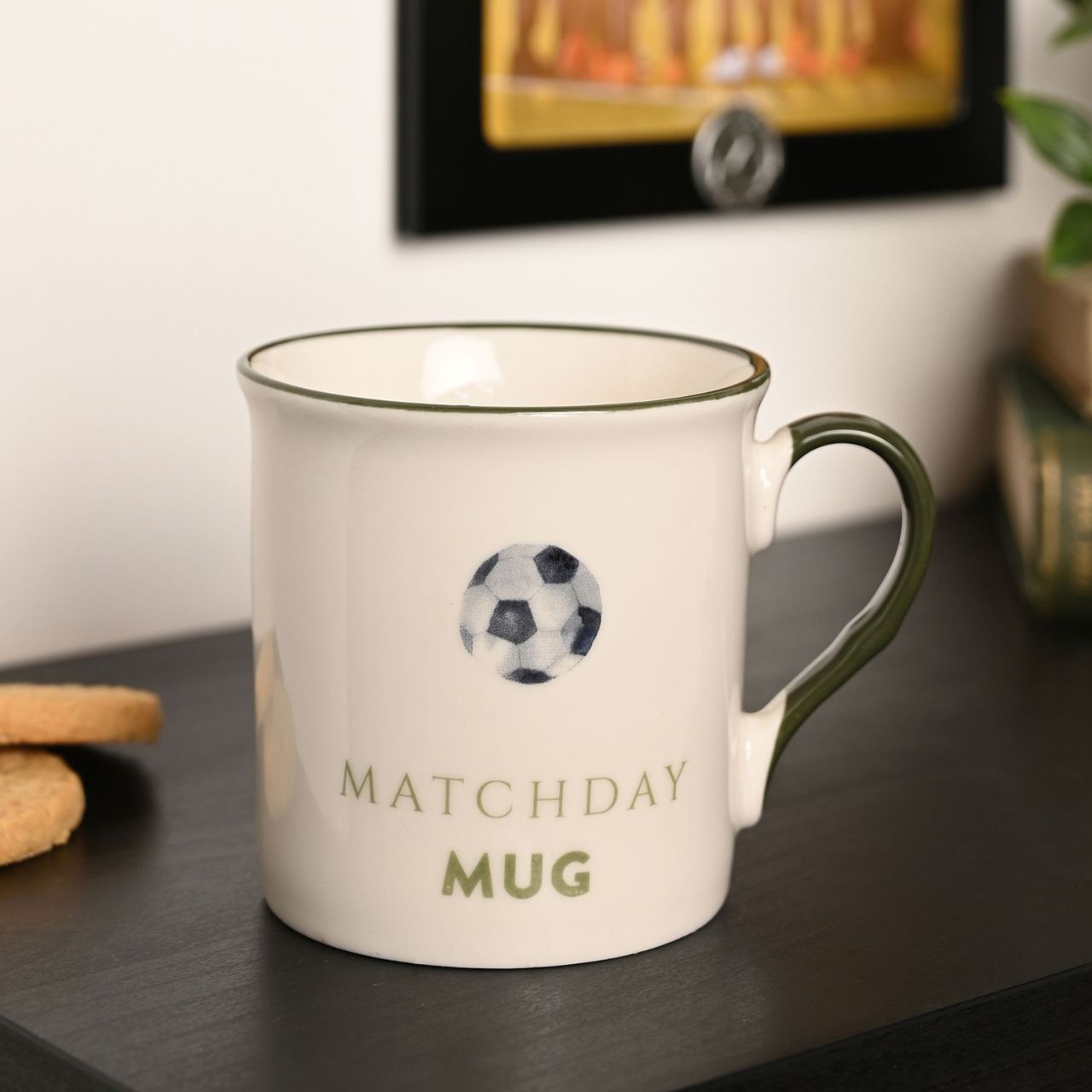 A white ceramic mug with a soccer ball design and the text "Matchday Mug" printed on it.