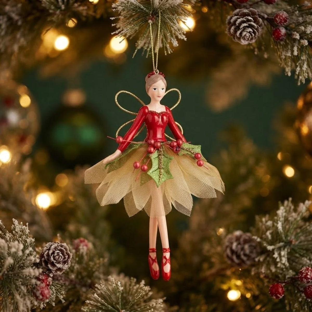 Enhance your holiday decorations with the Gisela Graham Red Green Gold Holly Fairy Hanging Christmas Ornament. Made with festive red, green, and gold colours, this hanging decoration features intricate holly fairy detailing that adds a touch of whimsy to your Christmas tree or garland. A perfect addition to your holiday collection.