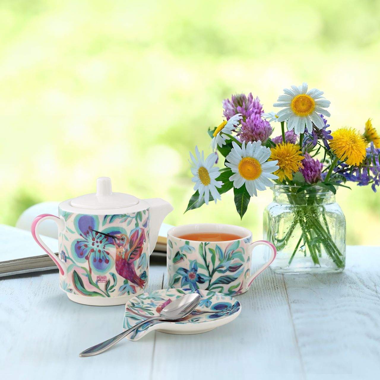 Small ceramic teapot with matching cup for 1 person. Perfect for drinking tea alone, and making this moment of relaxation your little moment to yourself. Original and colourful design by artist Michelle Allen for the Allen Designs collection.