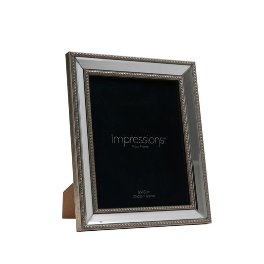 This elegant frame features a gold border with an intricate beaded pattern, adding luxury to your memories. The bold black background provides contrast, making "Impressions" stand out.
