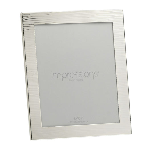Ripple Texture Silverplated Frame 8" x 10"  A silver plated ripple texture photo frame.  This beautifully decorated frame adds a modern touch to the home and gives treasured photographs the treatment they deserve.