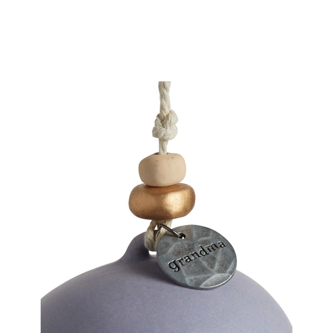 Give beauty and relaxation with our Inspired Bells collection, a selection of artisan bells in soft, serene colours with soothing, gentle rings bearing sentiments of faith and love. Our Inspired Bell - Grandma is a ceramic indoor/outdoor bell in lavender and white with a heart pull and a heart cut out.
