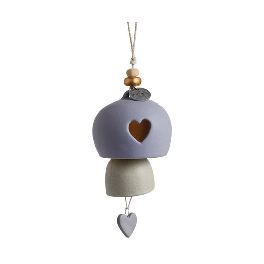 Give beauty and relaxation with our Inspired Bells collection, a selection of artisan bells in soft, serene colours with soothing, gentle rings bearing sentiments of faith and love. Our Inspired Bell - Grandma is a ceramic indoor/outdoor bell in lavender and white with a heart pull and a heart cut out.