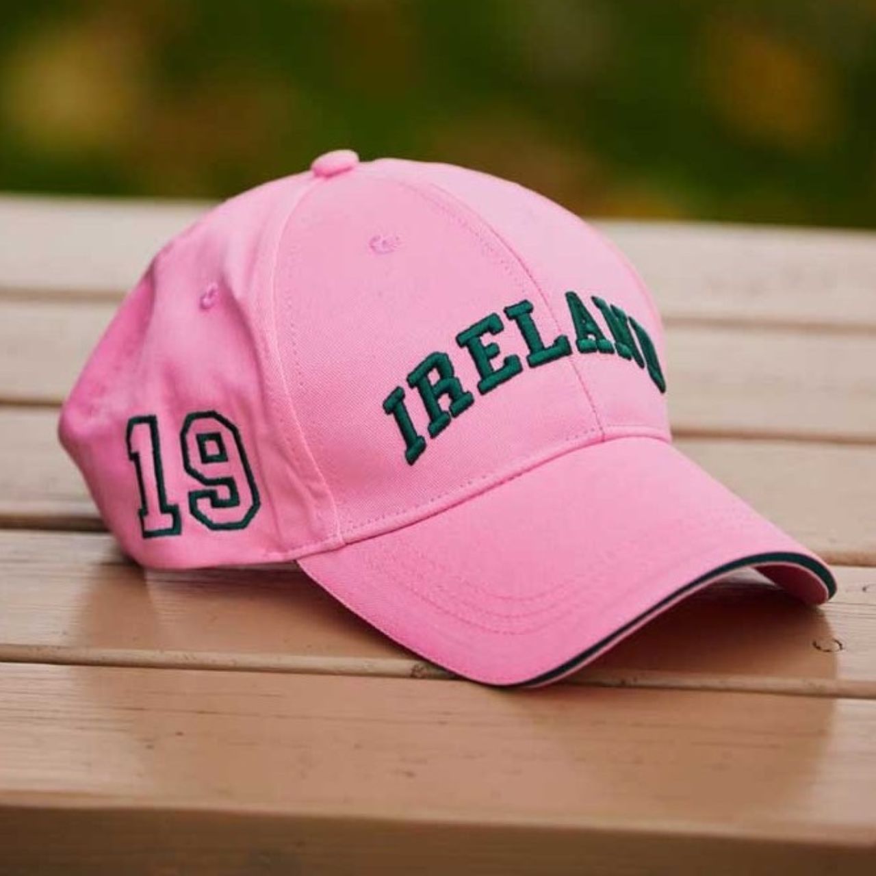 A playful baseball cap in pink and green with Ireland styling. Comfortable cotton construction throughout the day. A fun twist on a classic.
