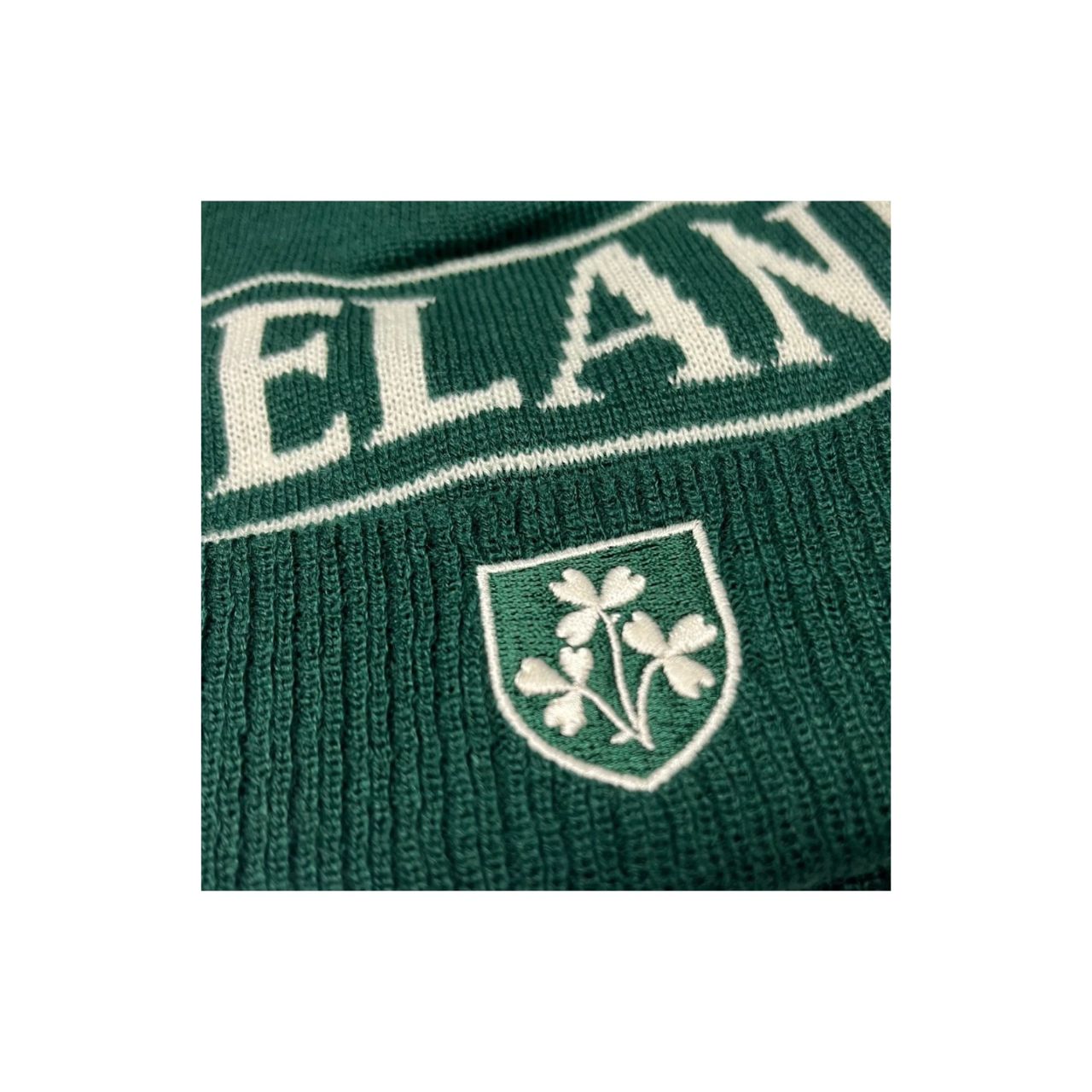 A soft beanie hat in bottle green and cream. Comfortable knit keeps warmth in. A classic Ireland winter staple.