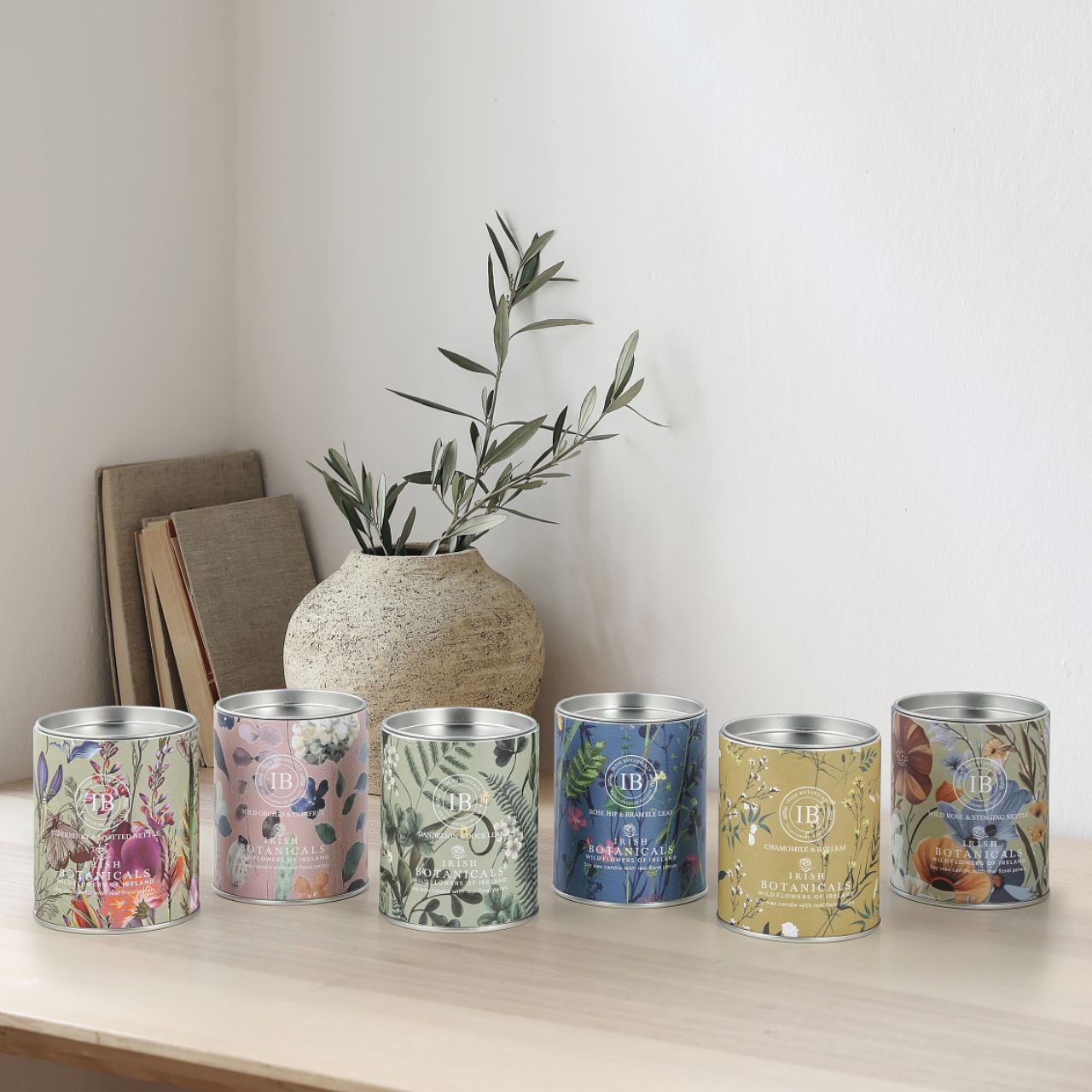 Expand your offerings with the Irish Botanicals Elderberry and Spotted Nettle Tin Candle, featuring harmonious Irish fragrances complemented by real dried flowers. Encased in an eye-catching, decorative tin, this candle combines portability with sophistication, appealing to customers seeking elegance and relaxation