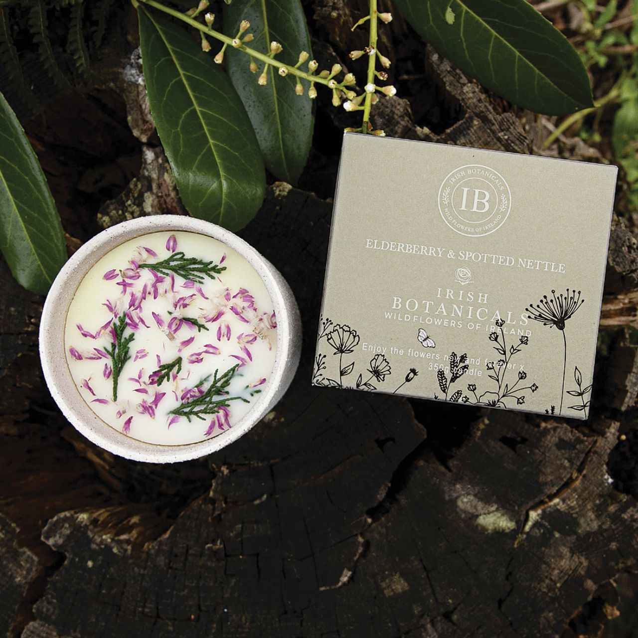 Transform your space into a serene haven with the Irish Botanicals Elderberry and Spotted Nettle Candle. Featuring real dried flowers, this candle adds an authentic touch to your sensory experiences. Poured into a stylish, textured container, it's perfect for bringing elegance and tranquillity to any room.