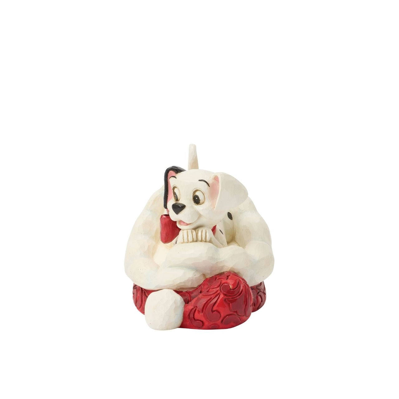 One of Disney's 101 playful dalmatians peeks out from a Santa hat in this adorable Jim Shore.