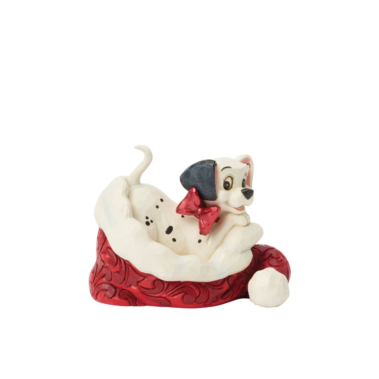 One of Disney's 101 playful dalmatians peeks out from a Santa hat in this adorable Jim Shore.