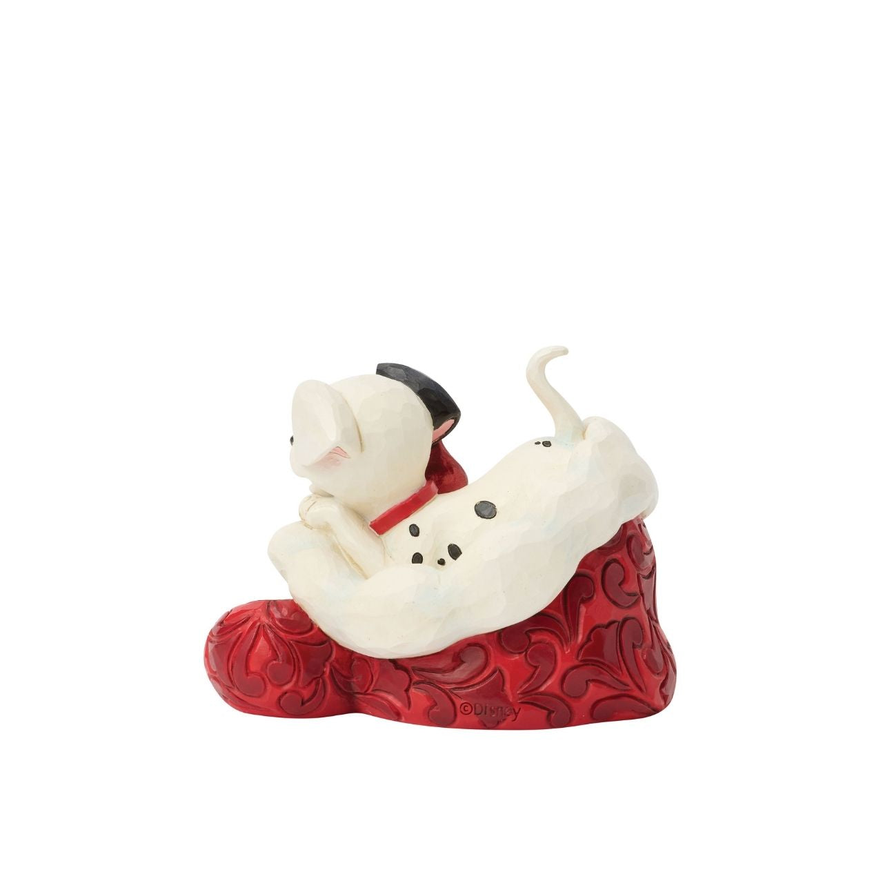 One of Disney's 101 playful dalmatians peeks out from a Santa hat in this adorable Jim Shore.