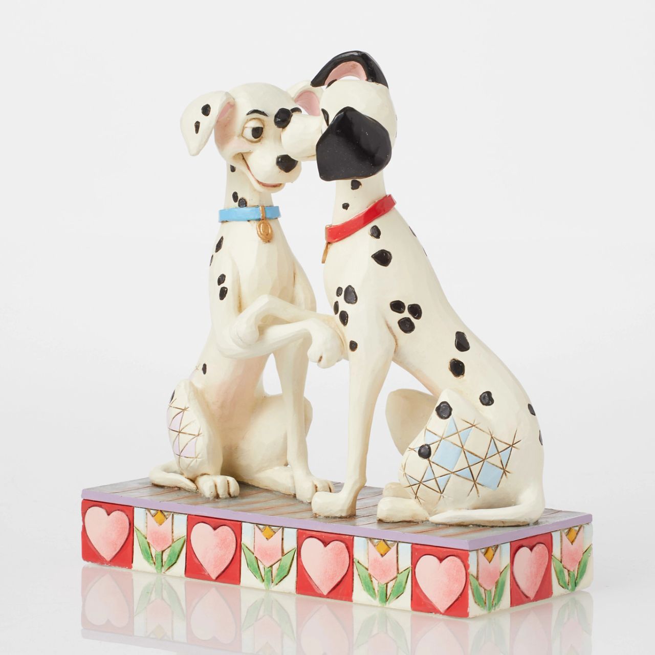 Disney's Pongo and Perdita from 101 Dalmatians show their puppy love in this sweet piece from the Disney Traditions by Jim Shore collection. Hand crafted and painted, this piece is perfect for Valentines Day, engagements, weddings and anniversaries.