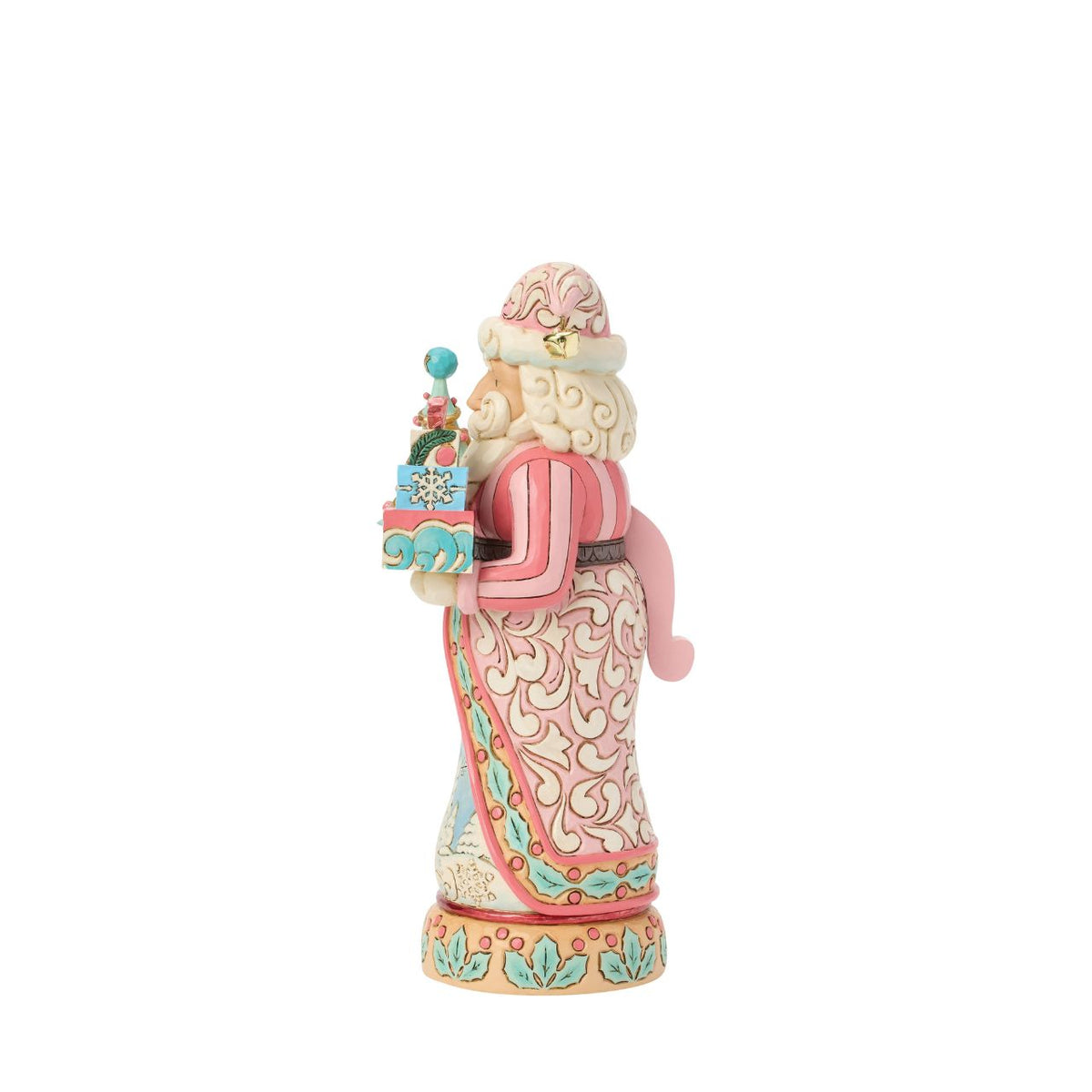 This sweet Santa nutcracker wears soft sherbet tones, blending candy-coloured charm with timeless holiday magic. Jim Shore's detailed rosemaling swirls across his coat, giving a fresh and playful twist to a traditional design.