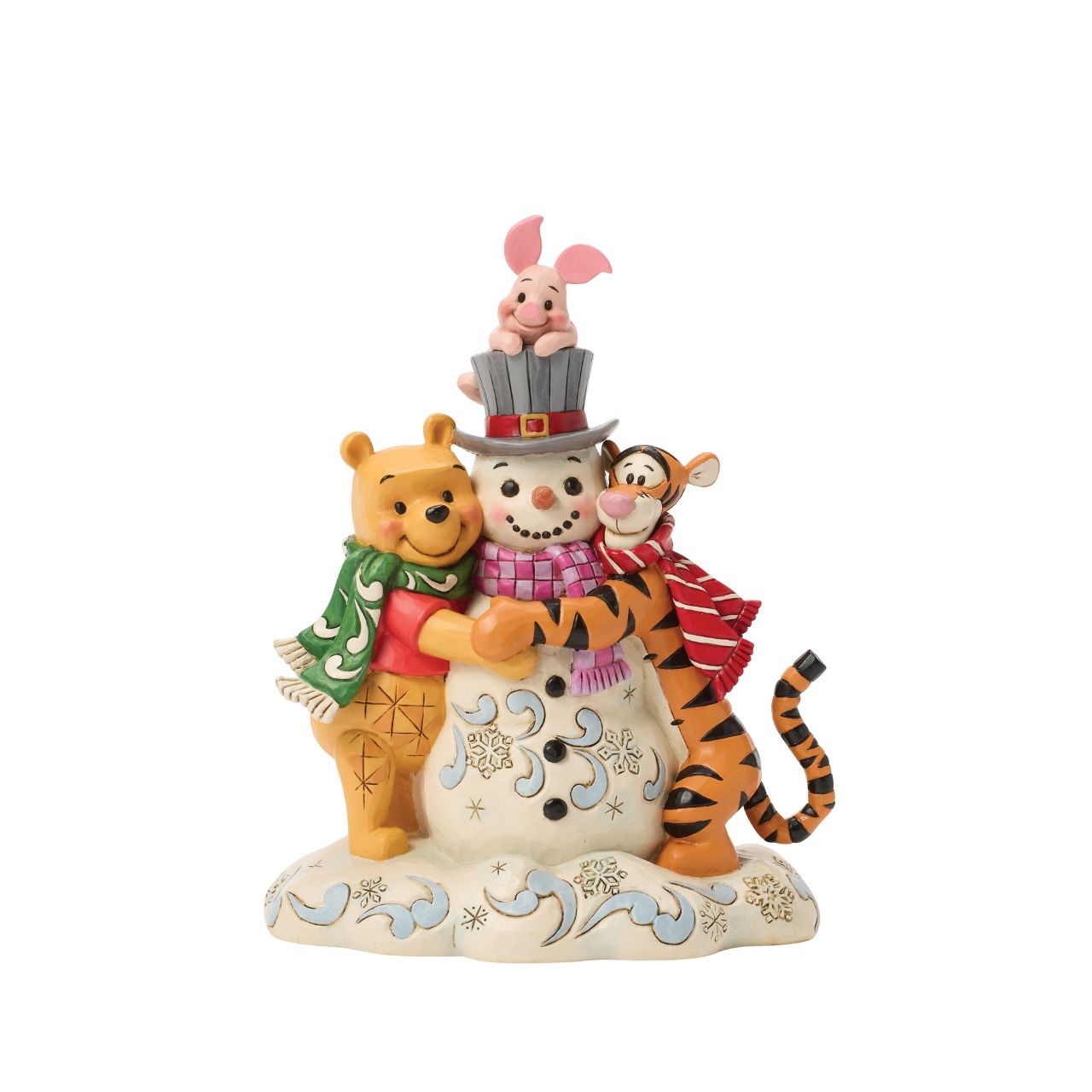 Pooh, Tiger, and Piglet build winter magic together in this cosy Jim Shore design. With bright scarves, rosy cheeks, and a jolly snowman, the scene captures the charm of snowy adventures and the sweetness of friendship with Jim Shore's iconic style.