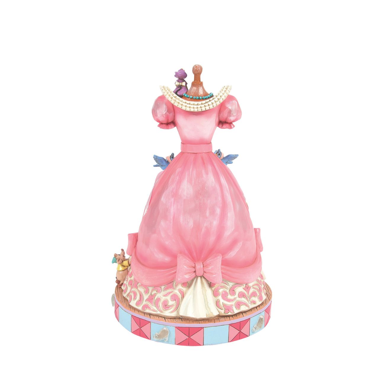 The iconic pink dress from Disney's 1950 masterpiece Cinderella, has been reimagined by artist Jim Shore. With Cinderellas bird and mouse friends, this beautiful dress comes to life. To make this figurine even more special, it plays A Dream is a Wish Your Heart Makes from the film.